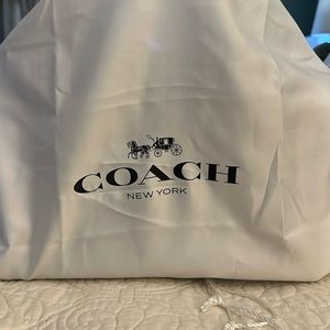 Beautiful brand new Coach pebble leather bag. Burgundy color w/ silver accents